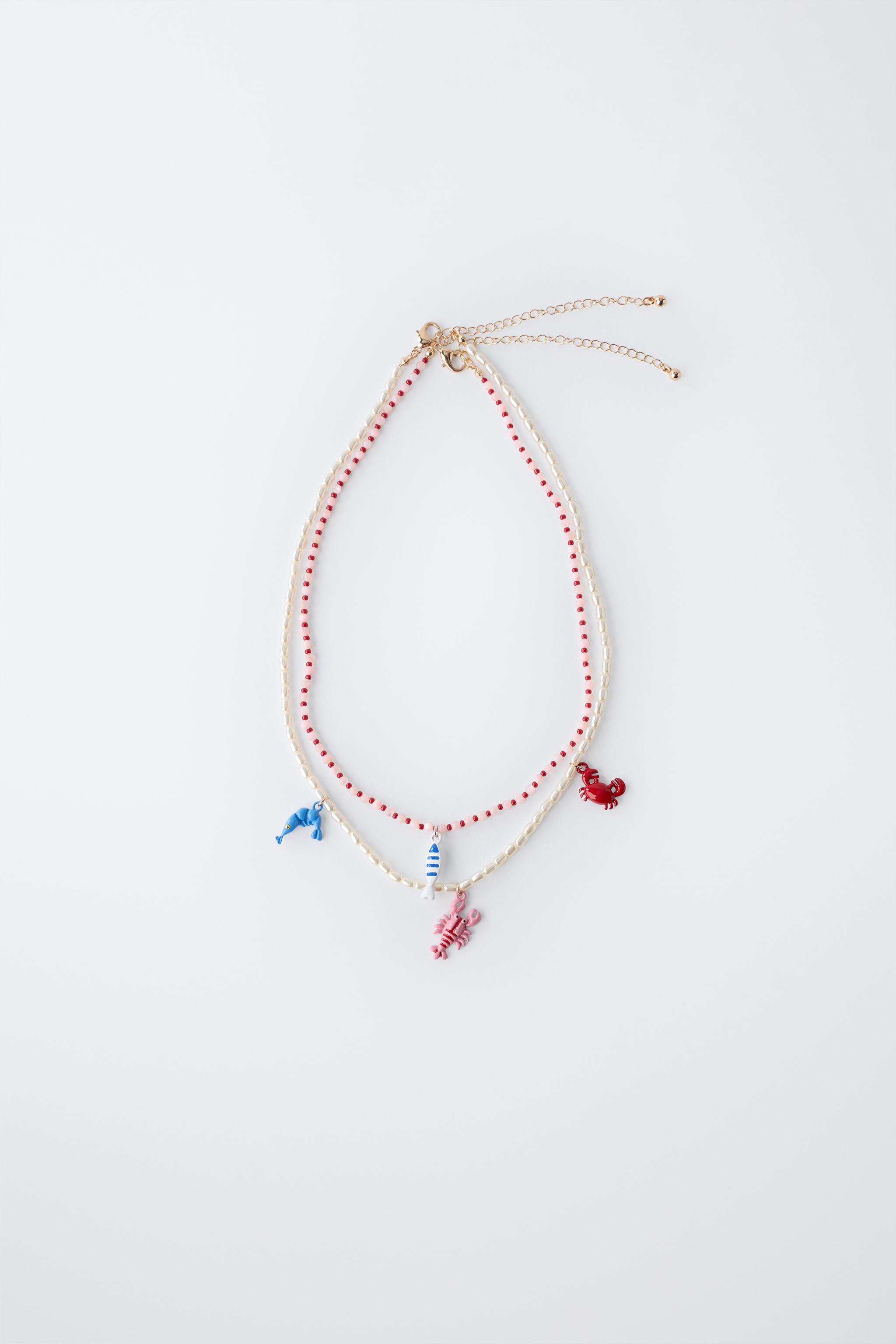 LOT DE DEUX COLLIERS PERLES ET FANTAISIE MER